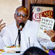William C. Rhoden tells the Journalists Roundtable in Washington last August about penalties faced by black athletes who protested in earlier eras. (Sharon Farmer/sfphotoworks)
